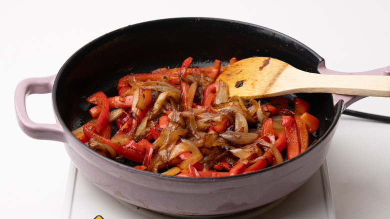 peppers and onions in pan