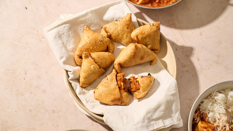 spicy curry samosas on table