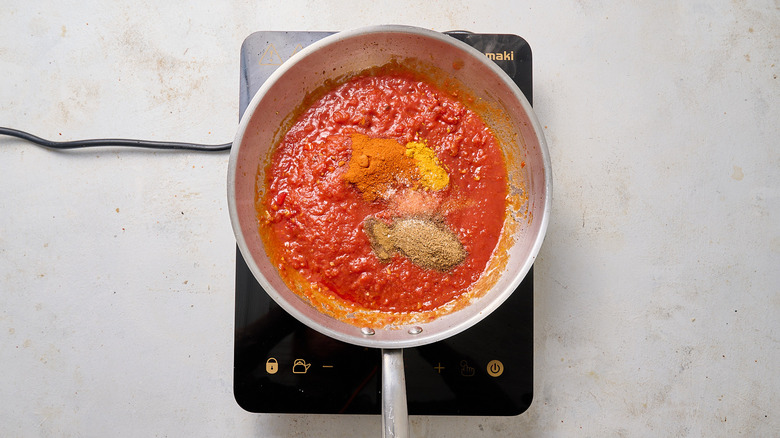 tomato sauce and spices in skillet