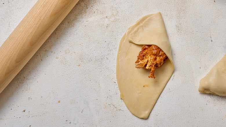 folding samosas into triangles