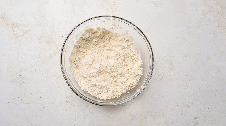 flour combined with ghee in bowl