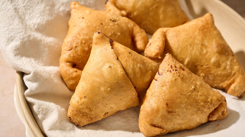 fried samosas on plate