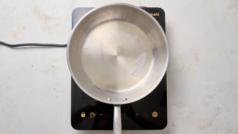 melting ghee in a skillet