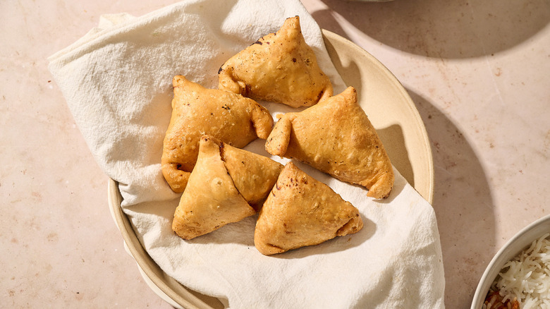 fried samosas on a plate