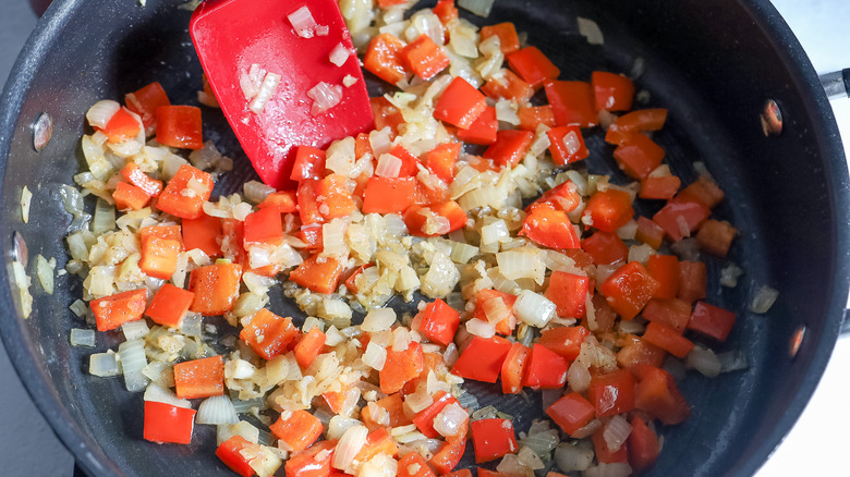 cooking peppers and onions