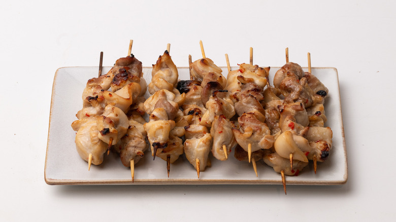 cooked satay chicken on skewers