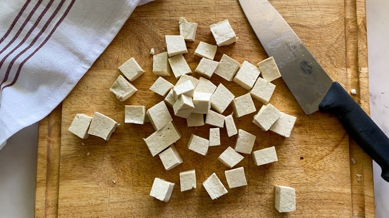 cubed tofu on cutting board