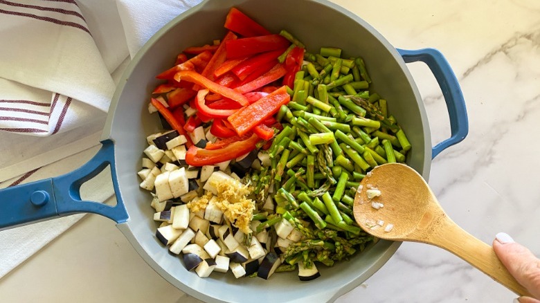 stir fry vegetables in pan