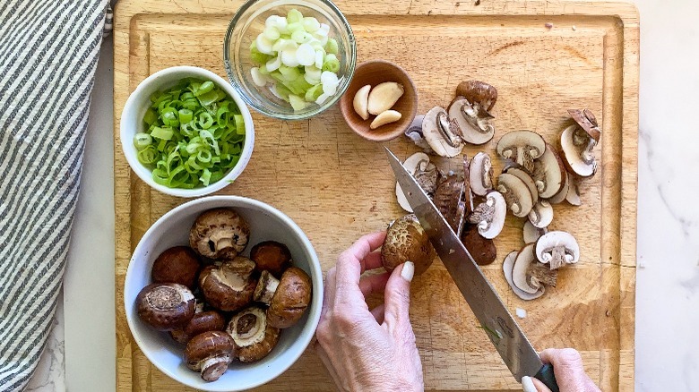 cutting mushroom on board