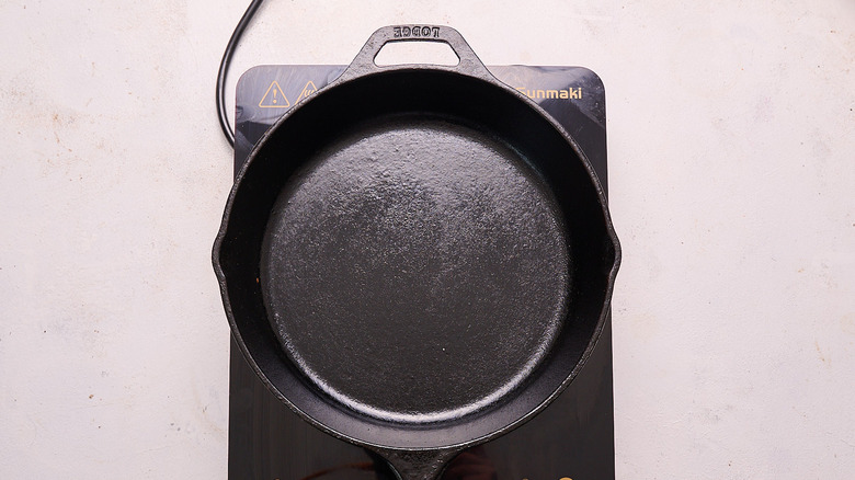 heating up a cast iron skillet