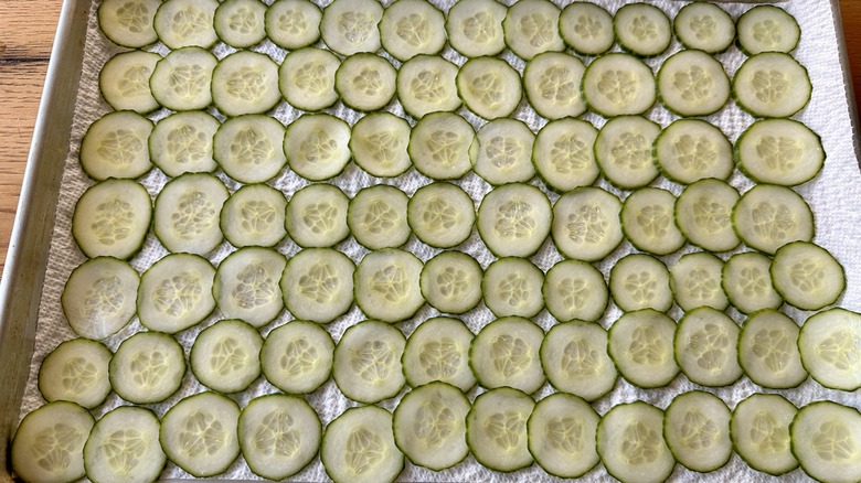 sliced cucumbers on sheet pan