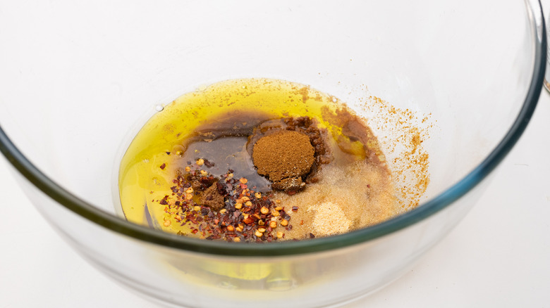 Mixing spicy cumin marinade