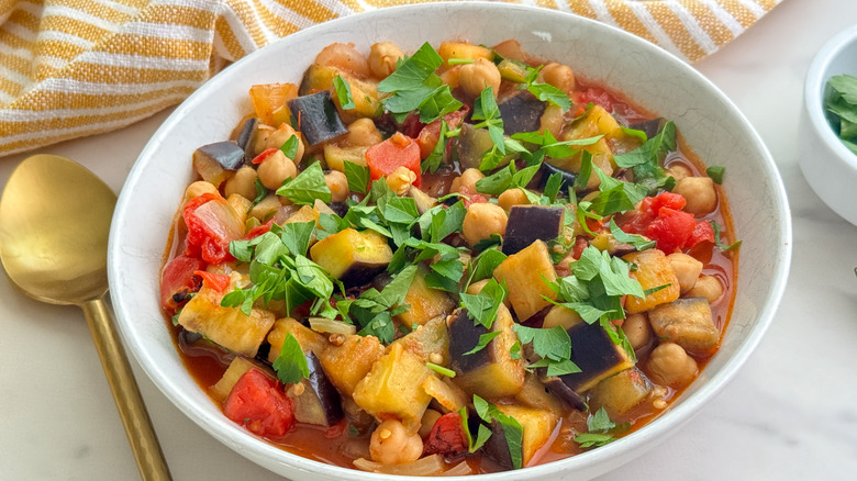 eggplant chickpea tomato stew in white bowl