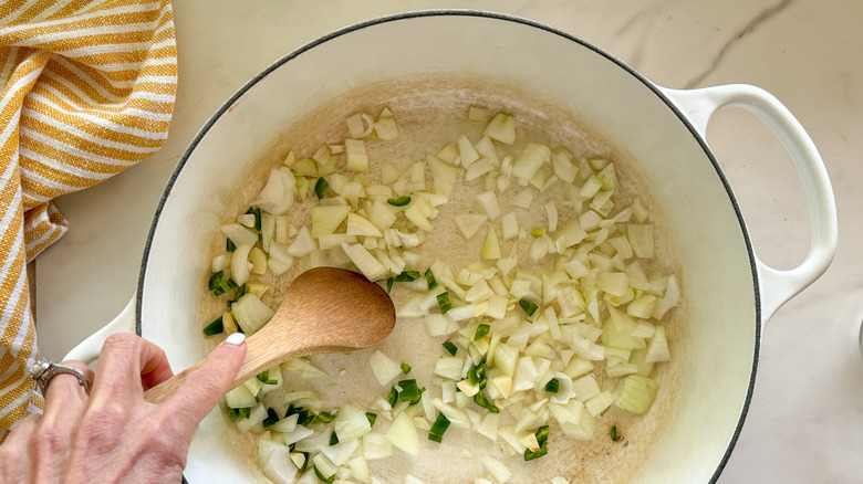 onion garlic and pepper cooking in pot