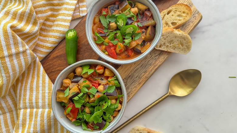 eggplant chickpea tomato stew in white bowls