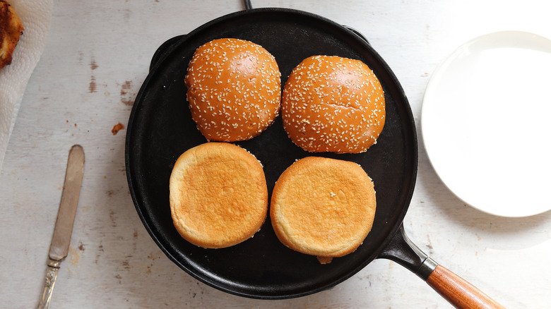 buns face down in skillet