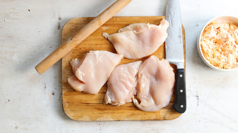 chicken breasts on cutting board