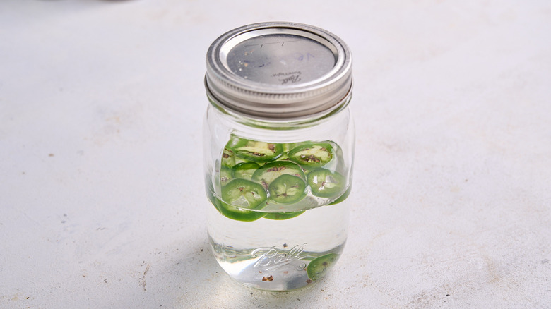 jalapenos in jar of vodka