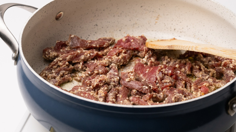 frying sesame steak in pan