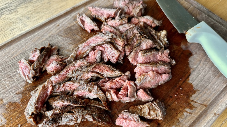 sliced steak with knife