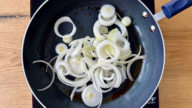 raw onions in frying pan