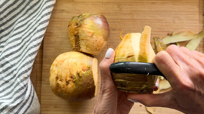 hand peeling rutabaga