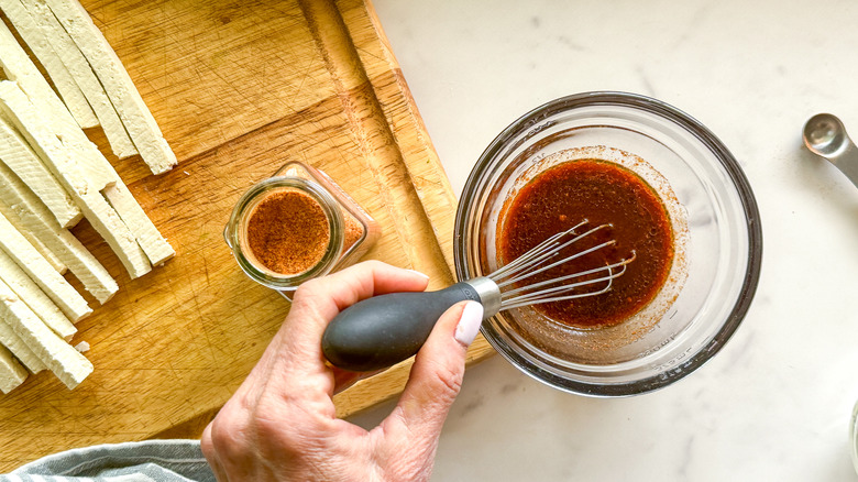 hand stirring sauce