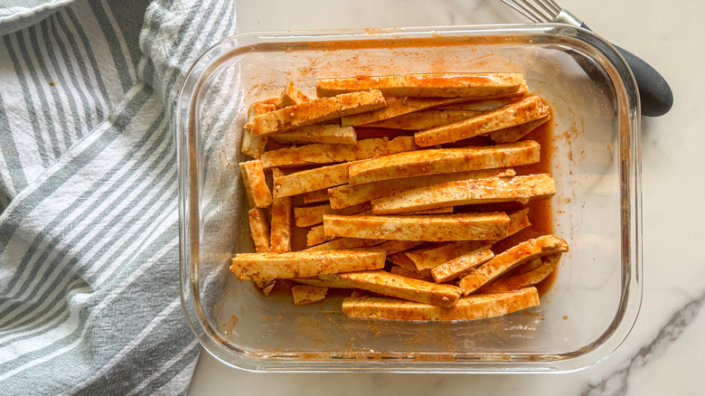 tofu in glass container