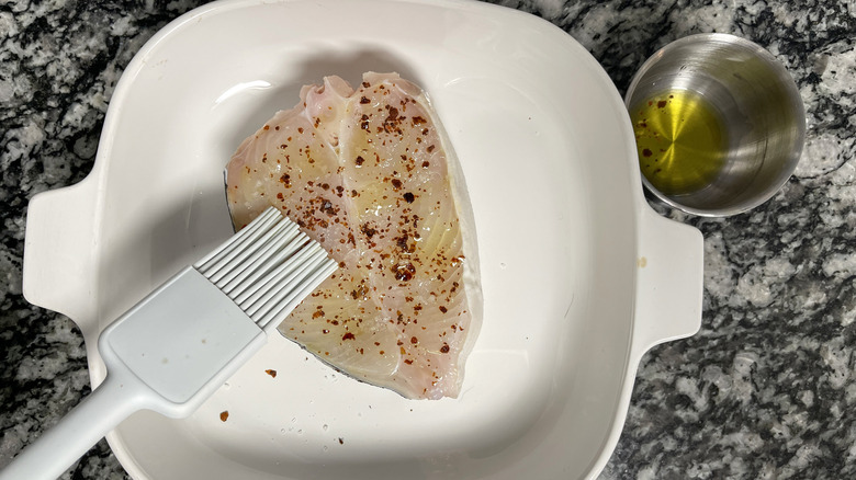 seasoned halibut fillet in pan