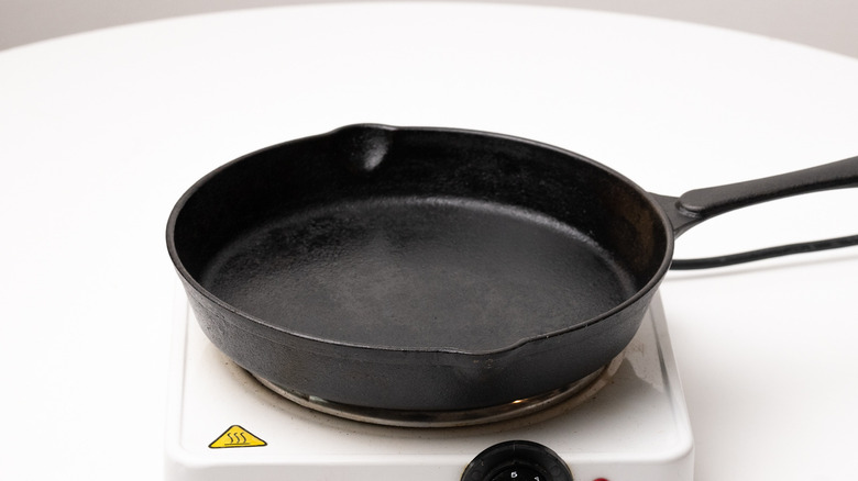 cast iron pan on heating element