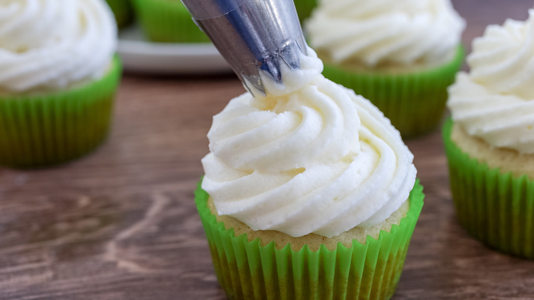 cupcakes being frosted