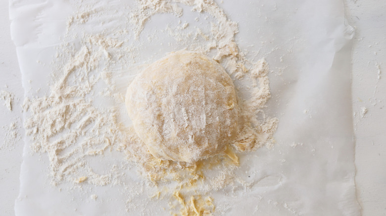 dough kneaded on a floured surface