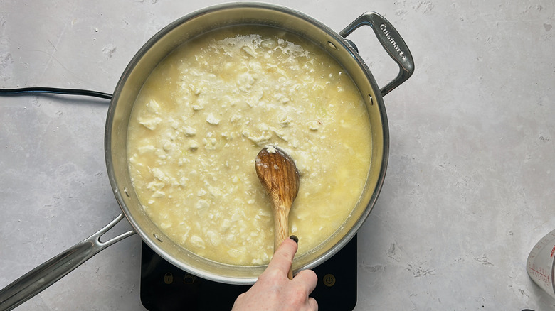 stirring feta into skillet