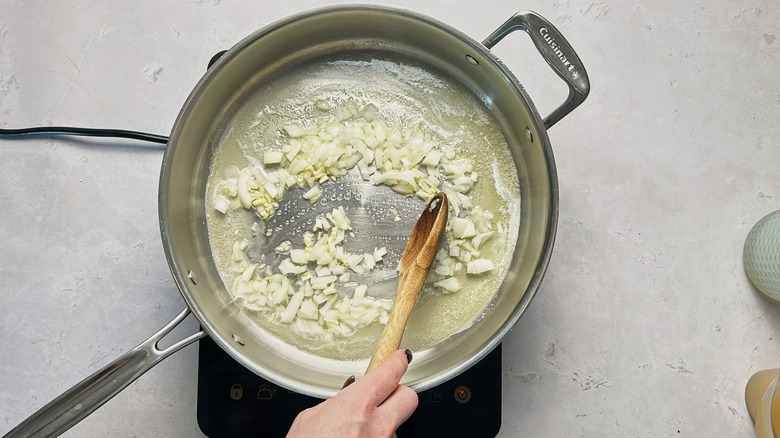 stirring onion in skillet