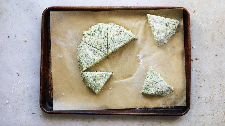 unbaked spinach scones on baking sheet