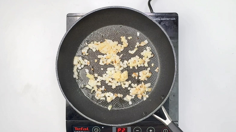 Onion and garlic frying in pan