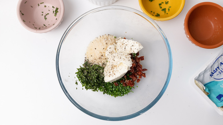 Mixing ingredients for stuffed chicken 