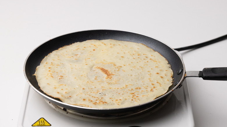 cooking crepes in a pan