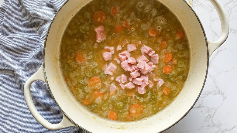 split pea soup in pot with ham