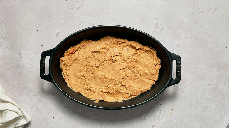 pinto bean dip in casserole dish