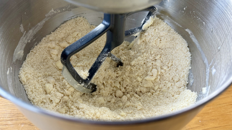 Mixing butter into pie dough