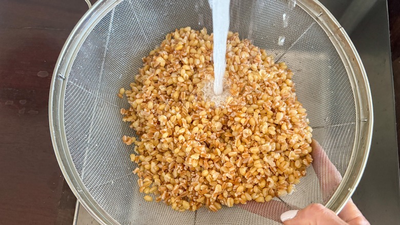 colander under running water