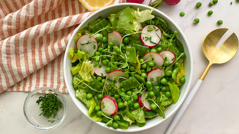 pea salad in white bowl