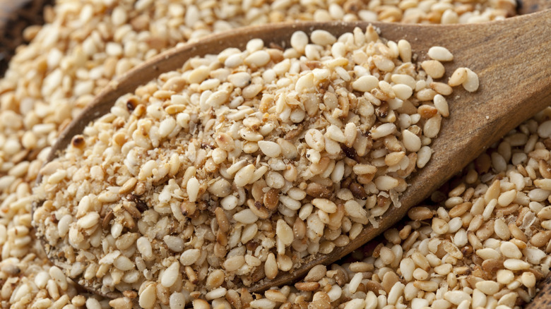 Close up of spoon with sesame seeds