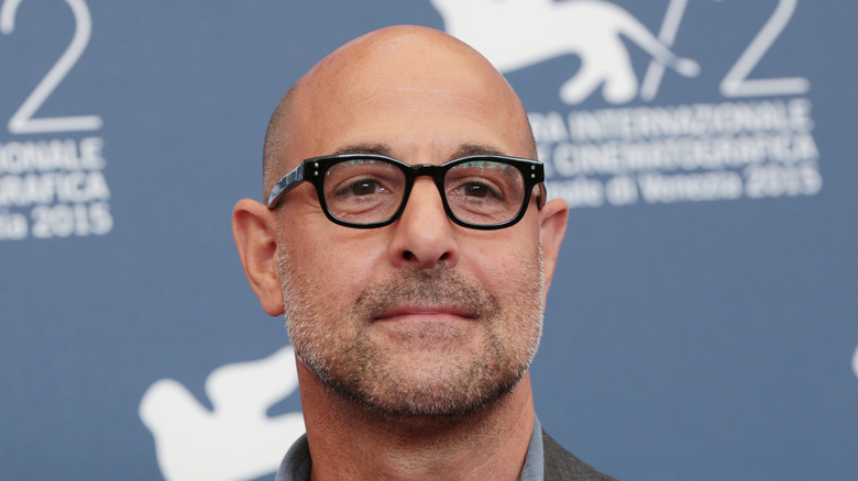 Stanley Tucci posing at event