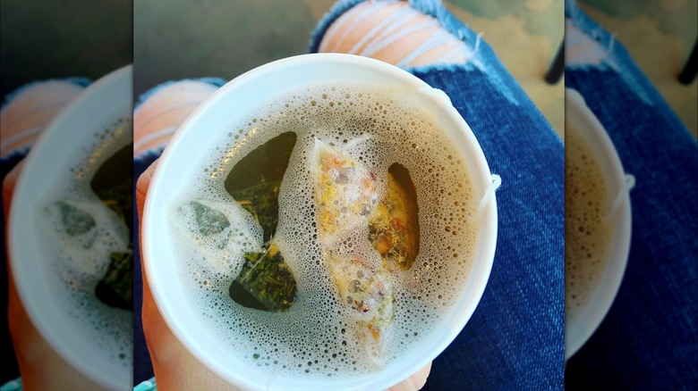 Overview of a steeping cup of Starbucks' Honey Citrus Mint Tea