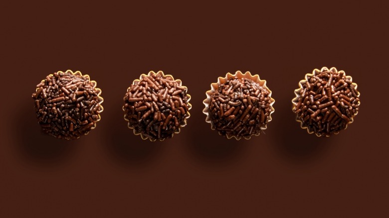 Top-down view of of four brigadeiros