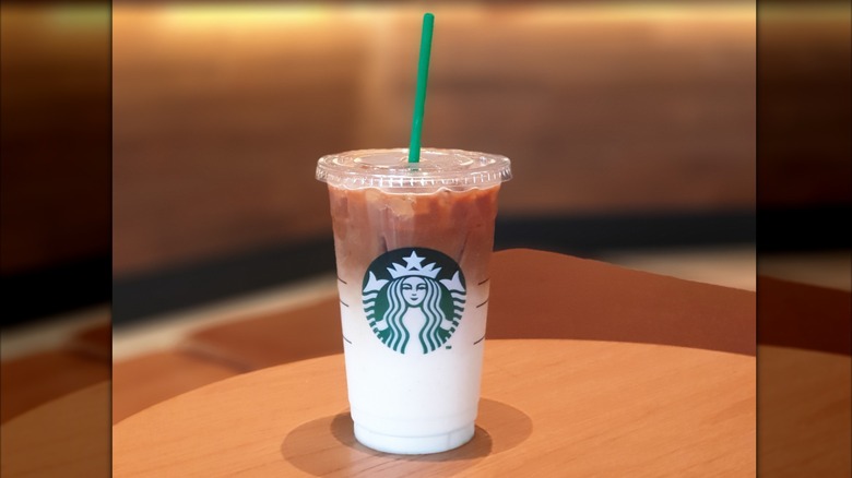 A Strabucks Iced Caramel Macchiato on a table