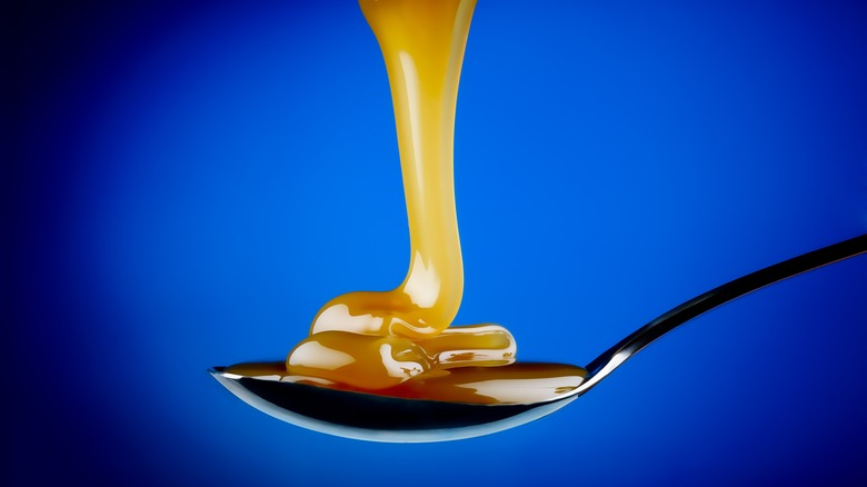 Caramel pouring onto spoon