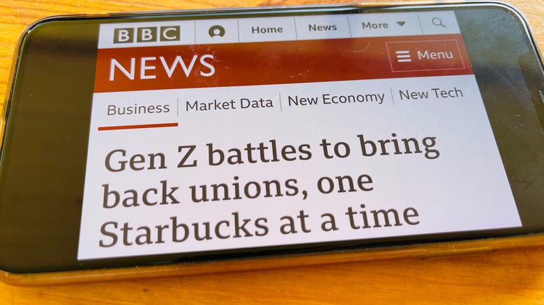 Phone with Starbucks union article